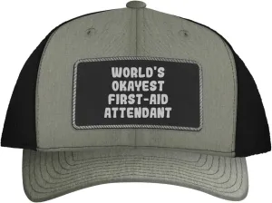 World's Okayest First-Aid Attendant - Leather Black Patch Engraved Trucker Hat